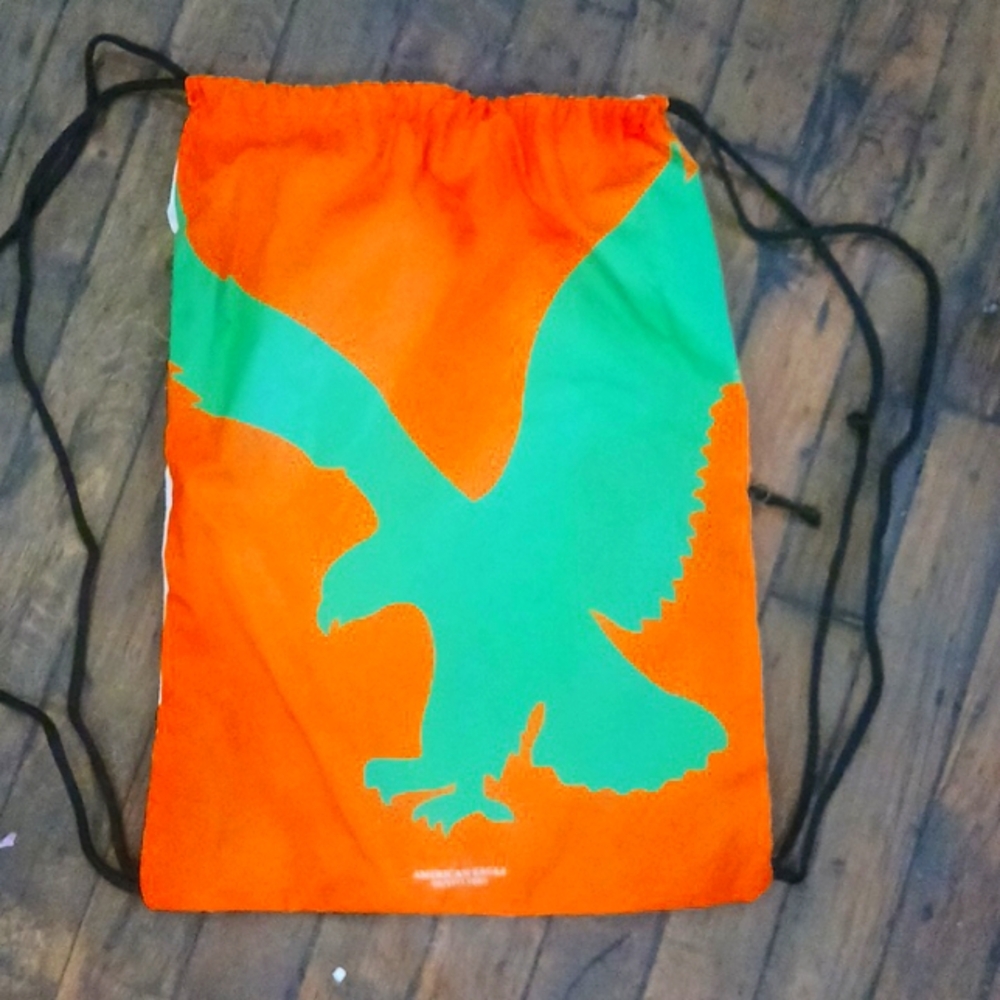 American Eagle Outfitters orange green and cream book bag
